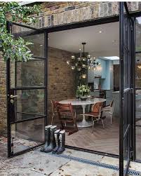 I Love Glass Doors Leading To Patios And Gardens Homedecor Homesweethome Dreamhome Courtyard Home Gard House Exterior House Design French Doors