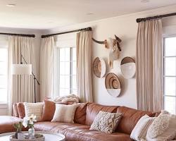 Image of Warm and inviting wallpaper with tan brown sofas