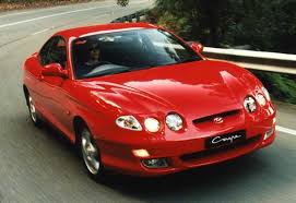 30 mpg,remote power door locks,power windows,cruise controls on steering wheel Used Hyundai Coupe Review 1996 1999 Carsguide