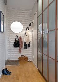 Apartments Awesome White Wallpaper On Entrance Wall With Cool Glass Wardrobe Design And Wooden Floor Cozy Apartment Interior Home Interior Design Living Room