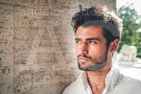 Buy the image. Handsome young man portrait. Intense look and eye-catching  beauty.