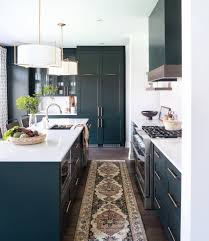 The look is timeless and clean and has the bonus of making the tiniest room look airy and spacious. Design Trend Green Kitchen Cabinets