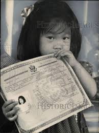 Press Photo Tami Williamson with Naturalization Papers