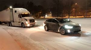 tesla model x electric suv tows a semi truck uphill that got stuck in the snow tesla model x tesla model semi trucks pinterest