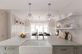 .bronze pendant lights for over the peninsula, and although we love mixed metals, we just thought this silver + mercury glass light didn't jive with them. Kitchen Peninsula Lighting Design Ideas