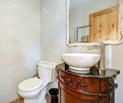 white half bath includes vintage vanity