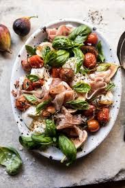 Fresh Fig Prosciutto And Arugula Salad With Cherry Tomato Vinaigrette Half Baked Harvest Recipe Summer Tomato Recipe Tomato Recipes Healthy Recipes