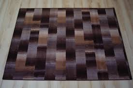 Das fell kann man auf niedrigster stufe saugen um staub und schmutz zu entfernen. Karo Patchwork Teppich Umkettelt Braun Teppich Janning