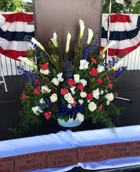 Bouquets featuring red carnations, gerbera daisies, or roses are some of the best red flowers you can buy. Large Red White And Blue With Calla Lilies By Flower Fiesta