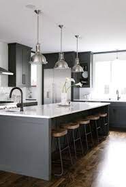 The gray tiles, a marble stove backsplash, and dark wood cabinetry break up the mostly white space with interesting texture and pattern. 30 Trendy Dark Kitchen Cabinet Ideas Forever Builders San Diego