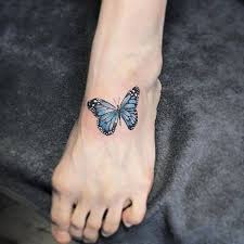 Blue Butterfly Tattoo On The Left Foot Blue Butterfly Tattoo Butterfly Wrist Tattoo Butterfly Foot Tattoo