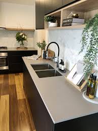 Matt Black Kitchen With Timber Shelf Detailing Caesarstone Sleek Concrete Benchtops And Herringbone Marb Interior Design Kitchen Kitchen Style Kitchen Benches