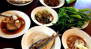 Nasi ulam can be enjoyed on its own, but it is also often served as a filling and refreshing side dish with fried fish or chicken. Kelantan Nasi Ulam Cikgu Restaurant Oneapps