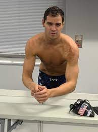 Michael swims the butterfly stroke from one end to the other, and his father calls out the time. Cizc4gjjsmwb6m