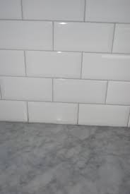 The most common grey grout material is porcelain. Tiles Going In Tomorrow Should I Change Grout Kitchens Forum Gardenweb White Subway Tile Kitchen Grey Countertops White Subway Tile Bathroom