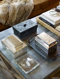 Come to think of this as a guideline, too, since groups of 5s & 7s can create the same visual appeal. Ralph Lauren Home S Celebratory Accessories Coffee Table Styling Ralph Lauren Home Decorating Coffee Tables