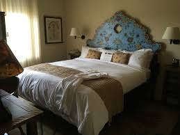 A painted headboard saves space and is budget friendly for your bedroom decor. Room 511 Hand Painted Headboard Picture Of La Fonda On The Plaza Santa Fe Tripadvisor