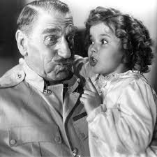 C. Aubrey Smith and Shirley Temple in John Ford's WEE WILLIE WINKIE. Temple  often cited this as a favorite among her films, "I marched, drilled, did  the manual of arms, and had