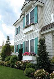Natural wood exterior shutters have been used for centuries. Custom Exterior Shutters Houston Outdoor Wood Shutters The Shade Shop