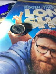 What is this coin with ROGEN CHARLIZE THER text?