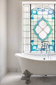 Browse a wide selection of modern stained glass panels and window hangings on houzz in a variety of patterns, colors and sizes for your home decor. Vintage Clawfoot Tub And Custom Stained Glass Window In French Country Master Bathroom By Moore H Glass Bathroom Stained Glass Windows Farmhouse Bathroom Decor