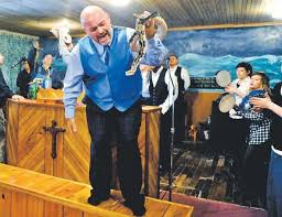Image result for photo of people in church with rattlesnakes