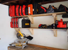The hooks on the underside of the shelves can hold bikes and pretty much anything else that can be hanged. How To Build Garage Storage Shelves On The Cheap