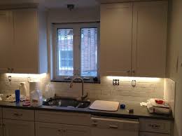 subway tile looks uneven under cabinet