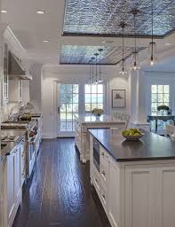 If you don't have an island and haven't invested in a freestanding kitchen island, it's worth considering. Kitchen Ceiling Design Above Island Pressed Tin Tiles In Kitchen Tin Ceiling Tiles From The Kitchen Ceiling Design Rustic Farmhouse Kitchen Spacious Kitchens