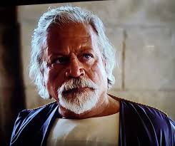 Oliver Reed in a playful mood with members of the cast