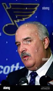 St. Louis Blues president John Davidson talks with reporters following the  team's trading defensemen Christian Backman and Bryce Salvador in St. Louis 
