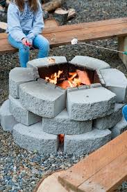 A combined fire pit and bbq grill keeps all outdoor fires in the same location. Cheap Fire Pit Ideas The Typical Mom