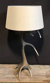 This lamp has a burnished bone ivory finish with a crackled wood tone base and cast aluminum accents. Lg 109 Lamp Red Stag Antler De Jong Interieur Recent Added Items European Antiques Decorative