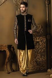 Buy Black Gold Velvet Alluring Sherwani With Mandarin Collar Full Sleeves Online Indian Groom Dress Indian Groom Wear Groom Wedding Dress