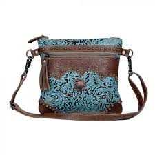 Rebecca's leggings feature the warrior (dragonfly) symbol, signifying happiness, speed and purity. Azure Aesthetic Leather Hair On Bag