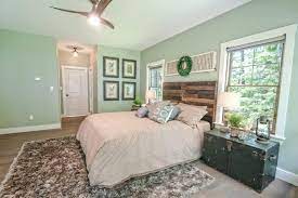 Deep green velvet cushions and curtains bring out the light green shades in the paper, and add warmth to this master bedroom. 40 Green Primary Bedroom Photos Green Master Bedroom Light Green Bedrooms Light Green Walls