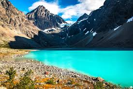The 50km bus ride and a short ferry crossing take about an hour, and it's well worth taking the trip. Hike To The Blue Lake Blaisvatnet In Lyngen Alps Northern Norway