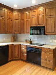 White upper cabinets and wall cabinets blend easily with. How To Make An Oak Kitchen Cool Again Copper Corners