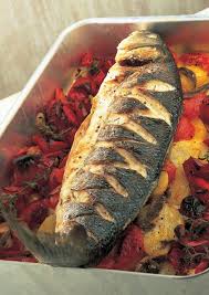 Baked Sea Bass With Roasted Red Peppers Tomatoes Anchovies And Potatoes The Happy Foodie Recipe Whole Fish Recipes Whole Sea Bass Recipes Baked Sea Bass
