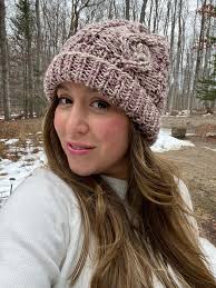 Embellished cable beanie with lazy daisy embroidery