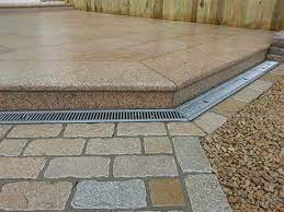 Fixing driveway drainage problems after installing a new driveway can be costly, so it's best to consider how to drain water away from the driveway whilst in the planning phase of your project. Channel Drain And Brick Slot Drain For Water Drainage Natural Stone Yard Close To M50 Dublin Ireland