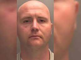 'High priest' of group pushing for 'holy race war' unmasked as Brit  delivery driver