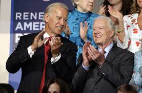 The photo shows carter and his wife sitting on armchairs, as jill and her husband kneel, towering over their hosts. Joe Biden Meets Jimmy Carter During Georgia Trip To Mark 100 Days