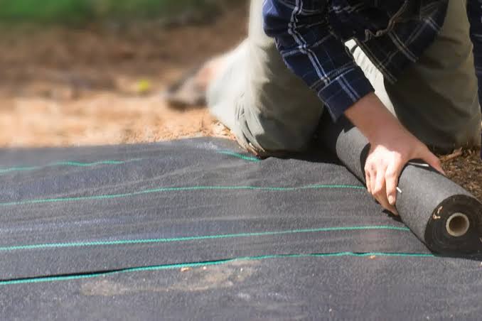 How to Install Landscape Fabric for Weed Control - Dreamscapes