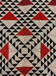 What Is Black And White And Red All Over What S Black And White And Red All Over Lady In Red By Shari Mcdonnell Guimont And Marlene Hiltner Machine Quilting Designs Triangle Quilt Quilts