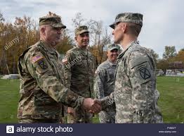 U S Army Maj Gen Jeffrey L Bannister Commander 10th Mountain Division Light Infantry Congratulates Lt Col Roger Zeigler Commander 186th Brigade Support Battalion Vermont National Guard After Receiving The 10th Mountain Shoulder