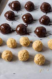 Peanut Butter Balls With Rice Krispies Are An Old Fashioned No Bake Candy Recipe That Makes Peanut Butter Balls Recipe Candy Recipes Peanut Butter Eggs Recipe