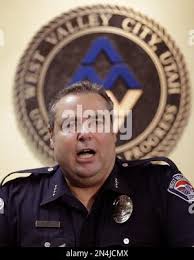 West Valley City's Police Chief Lee Russo speaks with reporters during a  news conference Thursday, June 19, 2014, in West Valley City, Utah.  District Attorney Sim Gill announced that a single count of manslaughter  had been filed against 33-year-old Shaun ...