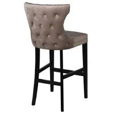 Explore the vast riches of a treasured heritage with the baron faux leather counter stool. Taupe Studded Barstool With Black Legs Corrinne Muir Interiors