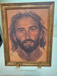 The Face Of Jesus Canvas Print By Artist Hook in woodtone frame.